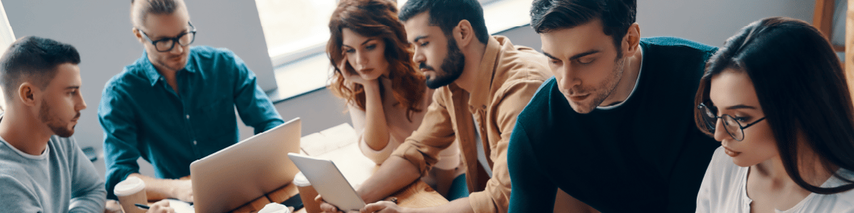 image-multiple-work-groups-gathered-around-a-large-table-reviewing-results
