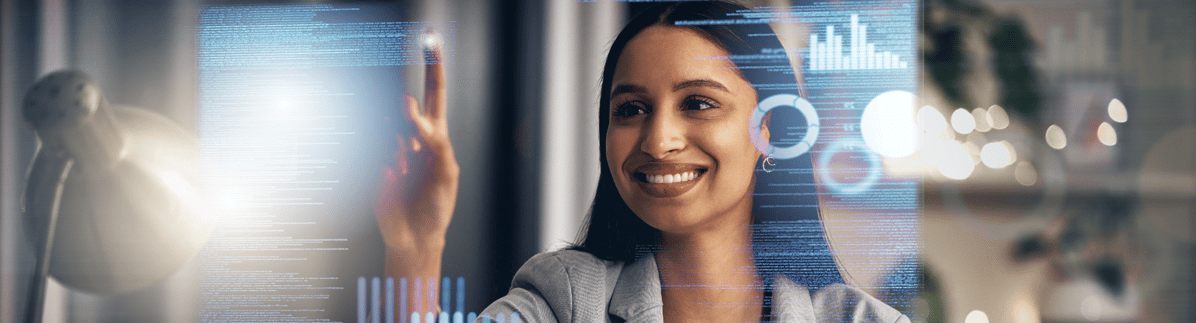 image-woman-at-desk-touching-a-digitality-projected-computer-screen